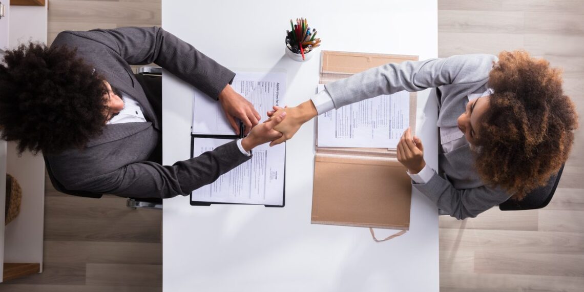 man and woman shaking hands