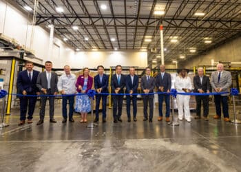Attendees_participate_in_a_ribbon-cutting_ceremony_to_celebrate_the_completion_of_the_facility