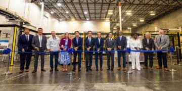 Attendees_participate_in_a_ribbon-cutting_ceremony_to_celebrate_the_completion_of_the_facility